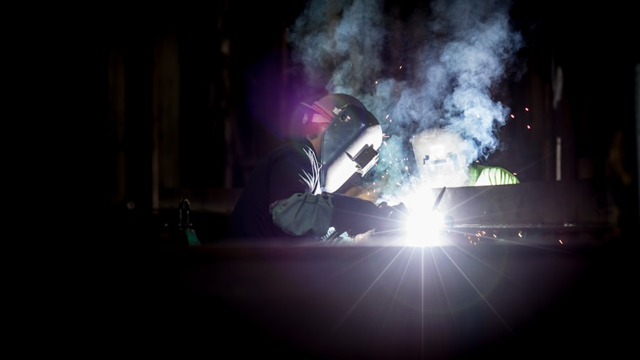 Welder in protective gear working, representing Ausbildung vocational apprenticeships in Germany