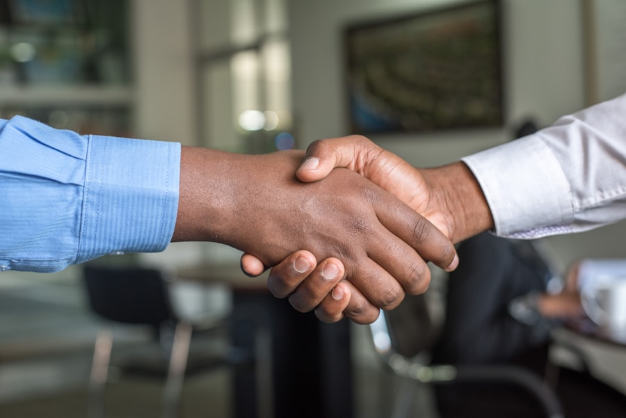 A recruiter and candidate shaking hands, representing TalentSpan's placements across both blue-collar and white-collar roles