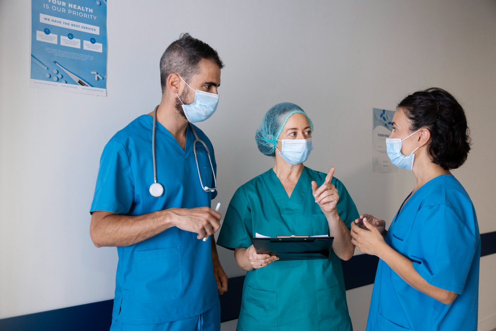 Healthcare professionals in scrubs consulting together, representing WorkSpan Global's healthcare support placements