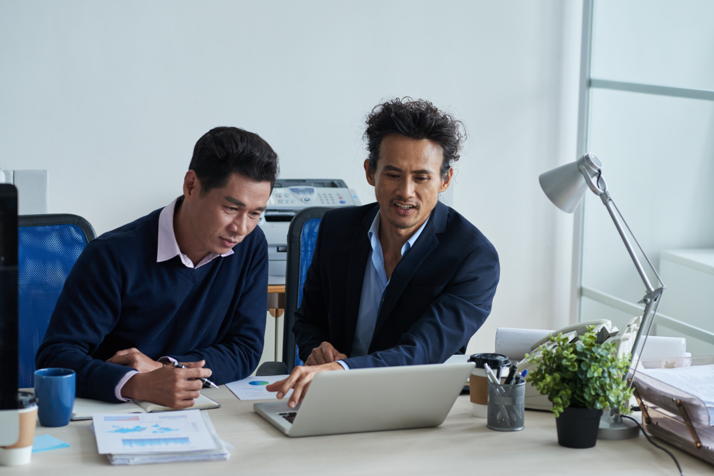 Office professionals collaborating, representing TalentSpan's white-collar placements