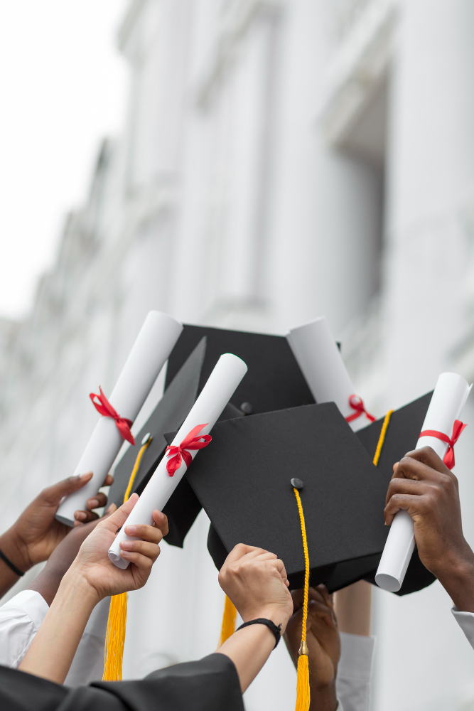 Graduates celebrating, throwing caps in the air, representing EduSpan's study abroad outcomes